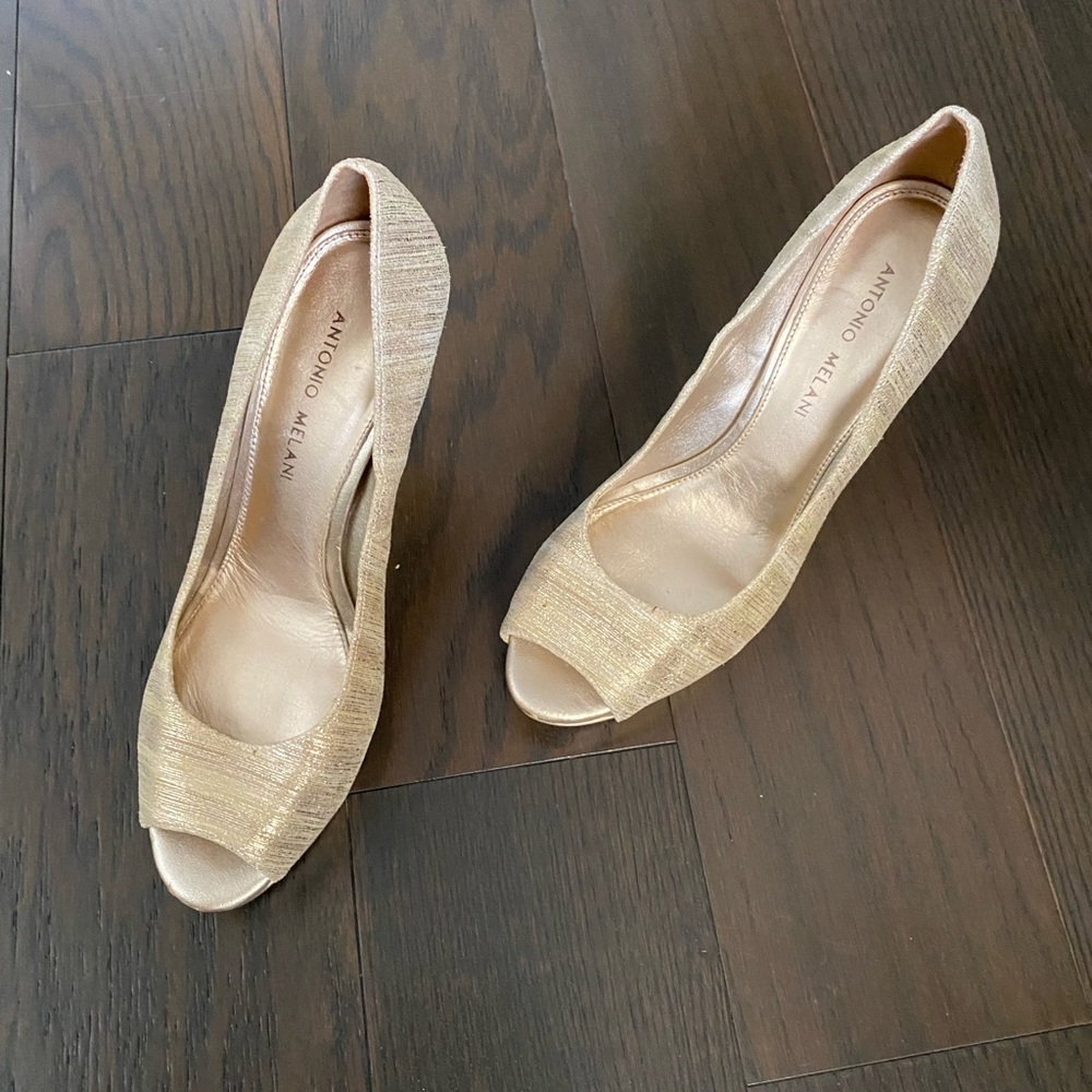 Elegant and Beautiful high heel shoes in golden tone.